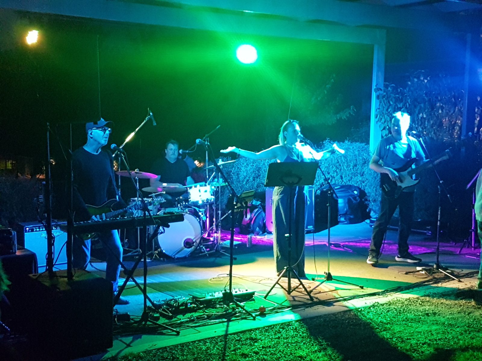 Live band performing an outdoor night show